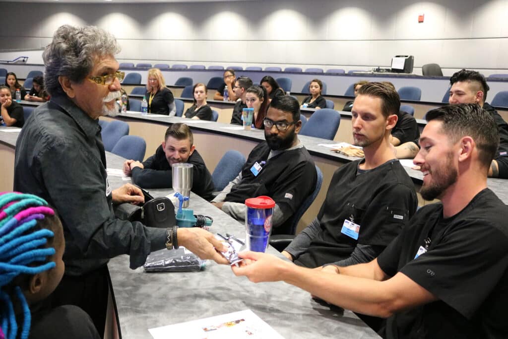 Ben De Cordova shows MTC barber students his unique barber tools