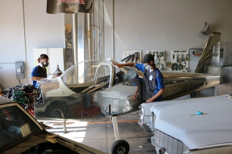 Auto Collision students paint airplane for teen aircraft builders