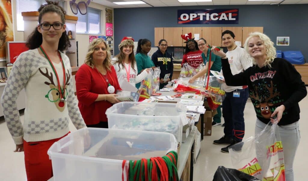 MTC-Optometric-Assisting-class-stuffing-2000-bags-for-LWR-2017-Jingle-5K-to-benefit-Manatee-Memorial-Foundation-