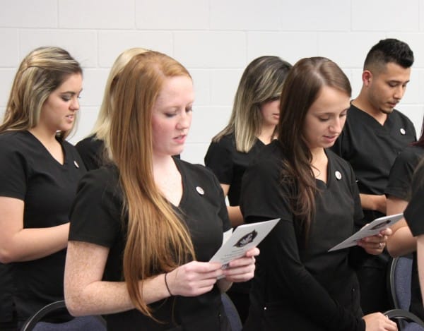 grads reciting pledge