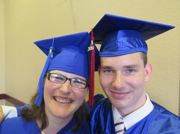 Manatee Technical Institute students Amber Osmun, 36, and her son, Joey, 18, right, received their Florida general equivalency diplomas Sunday during MTI's historic 50th graduation.RICHARD DYMOND/Bradenton Herald